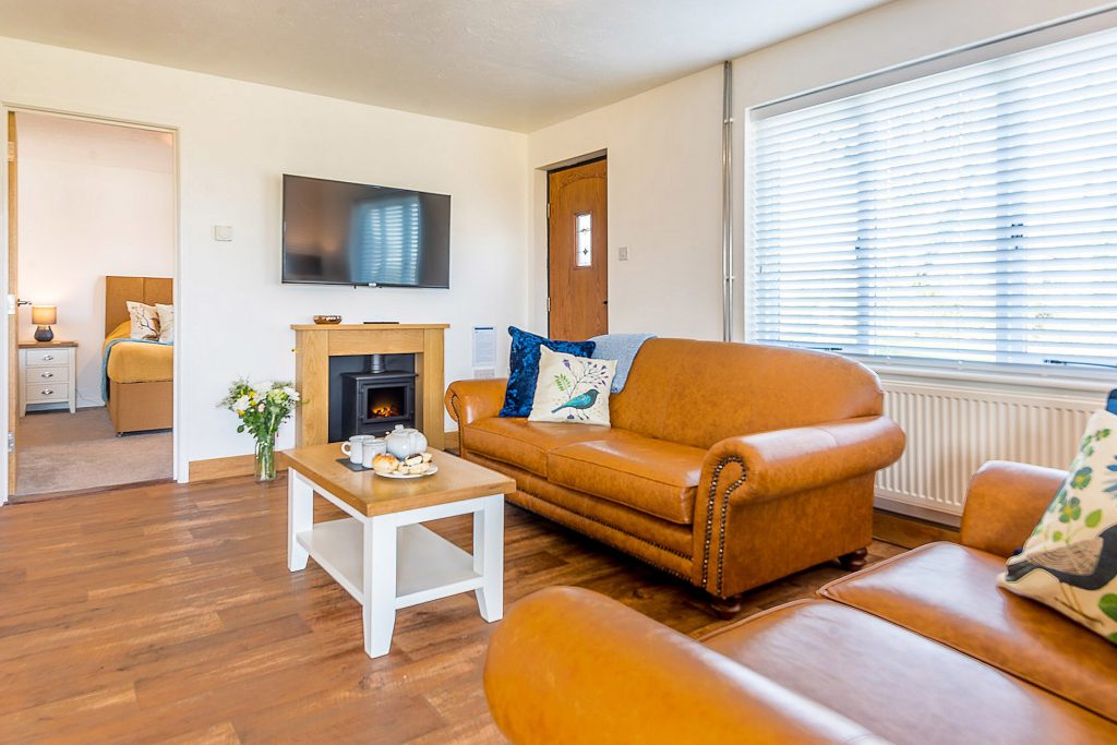 Dog friendly Elm Cottage at St. Tinney Farm Holidays in Cornwall - Lounge area with free WiFi and 50 inch smart TV
